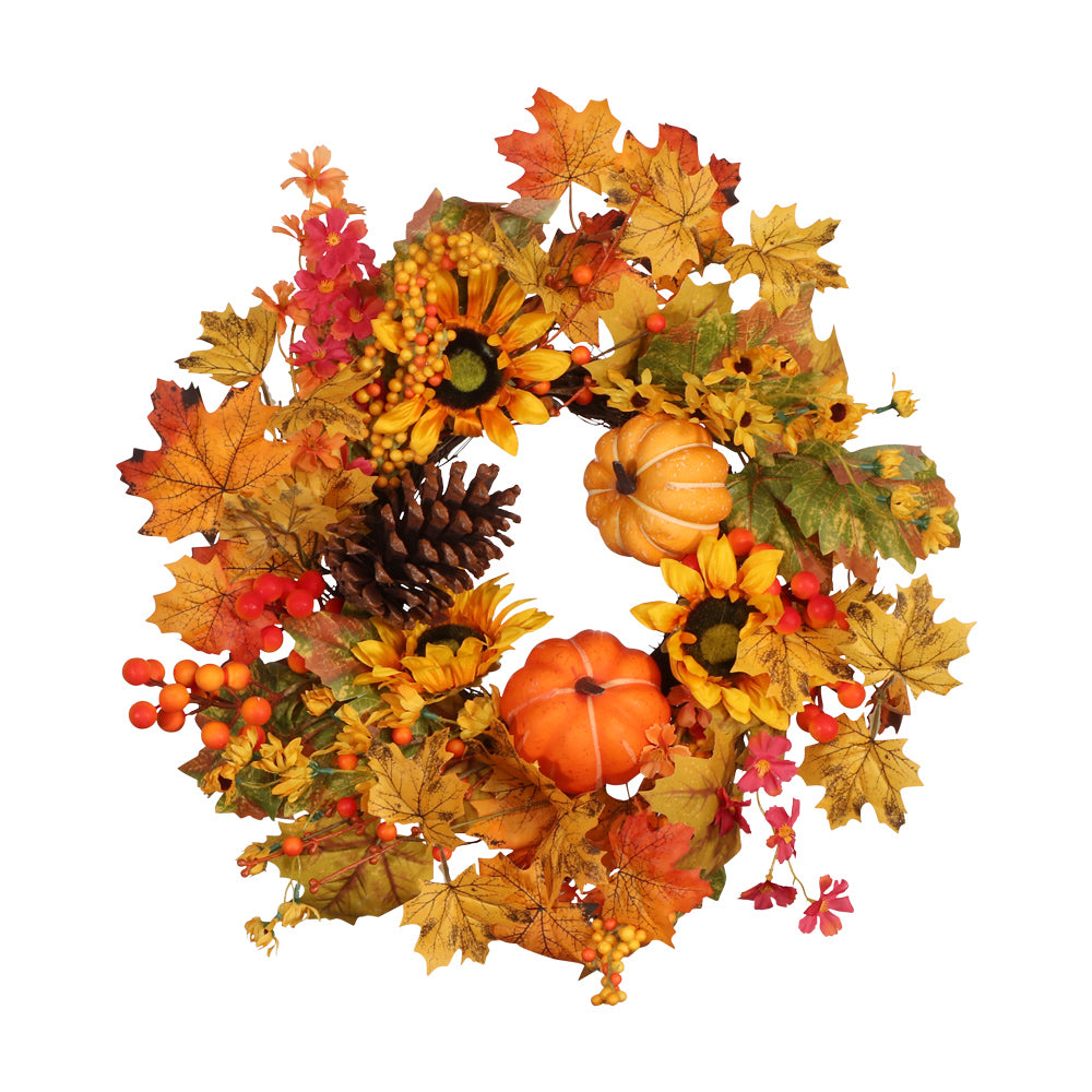 Couronne d'automne de tournesols, baies, pommes de pin et citrouilles, vue de face