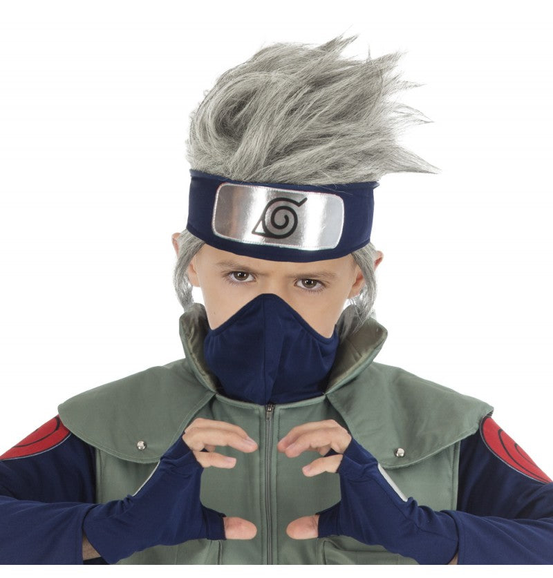 The image shows a child wearing a Kakashi Hatake wig from the anime Naruto Shippuden, styled with spiky silver hair and a headband featuring the Hidden Leaf Village symbol.