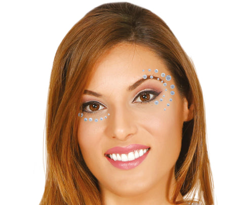 Silver and blue adhesive face jewels for women, resin makeup accessories for face decoration and festival looks.