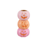 Bougeoir Halloween en résine formé de trois citrouilles souriantes empilées, vue de face