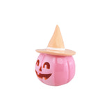 Citrouille Halloween rose vif à chapeau de sorcière pêche, vue de profil pour table d'Halloween