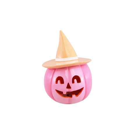 Citrouille Halloween rose vif en résine avec chapeau de sorcière pêche, vue de face, décoration d'Halloween