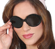 Retro black 1960s style sunglasses made of PVC, vintage accessory for costumes or themed parties.