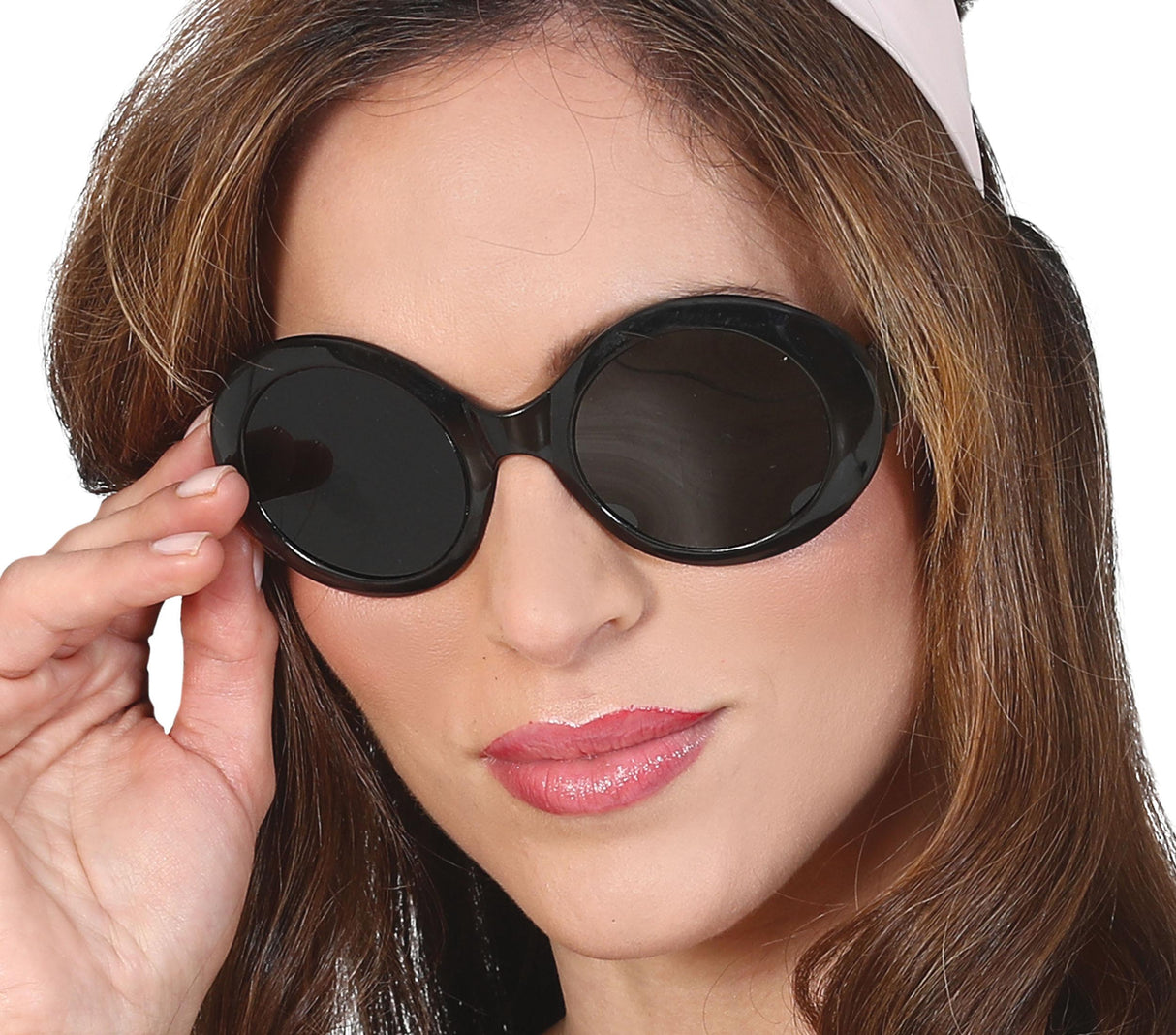 Retro black 1960s style sunglasses made of PVC, vintage accessory for costumes or themed parties.