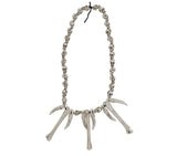 Collier homme des cavernes tête de mort beige PVC - Halloween
