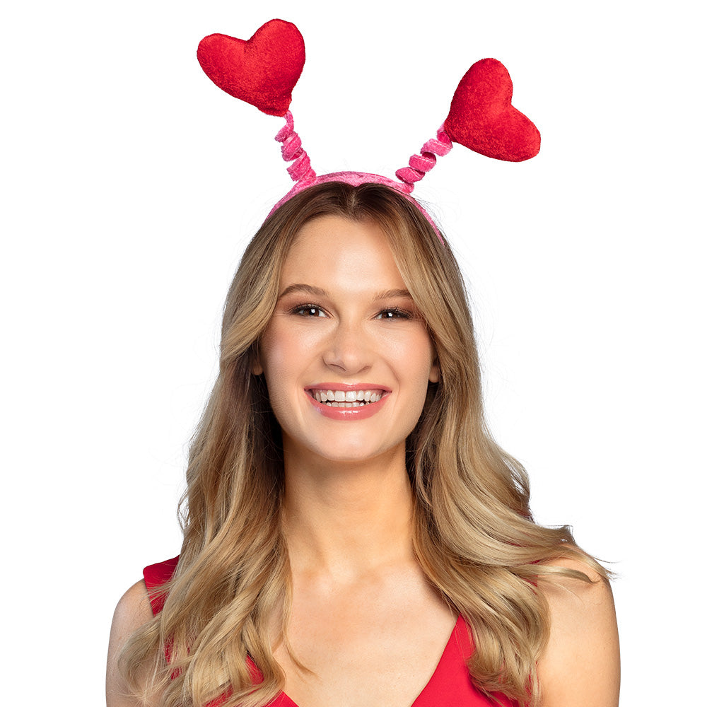 Red tiare headband for women featuring waving heart designs, made of polyester and polypropylene, ideal romantic accessory for adults.