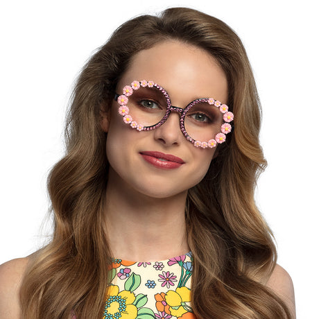 Pink party sunglasses for women, 60s and 70s hippie style, adult size, made of polypropylene, polyethylene, and acrylic.