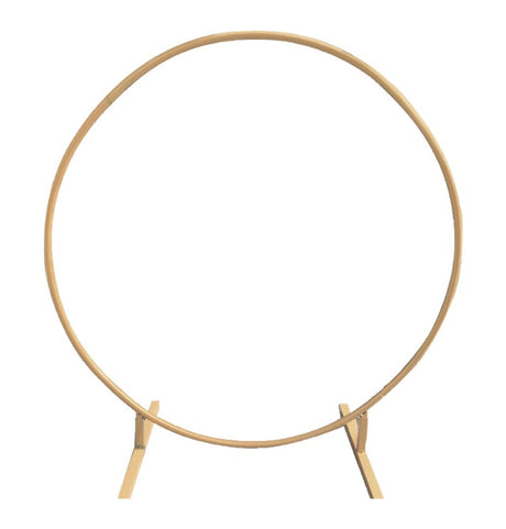The image shows a large, circular metal arch with a gold finish, likely intended for use as a decorative structure at a party or ceremony.