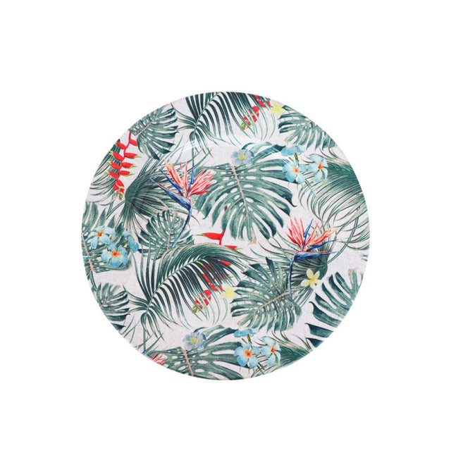 The image shows a decorative party plate with a tropical theme, featuring vibrant green palm leaves and a white background.