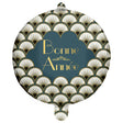 The image shows a round foil balloon with a "Bonne Année" (Happy New Year) message in French, featuring a blue and gold Art Deco flapper design.