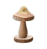 The image shows a decorative gold-glittered mushroom ornament on a wooden base, likely intended as a party decoration.
