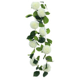 The image shows a decorative garland featuring nine white dahlia flowers arranged along a 220 cm string, suitable for party or event decoration.