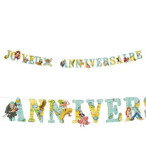 The image shows a "Joyeux Anniversaire" (Happy Birthday) party garland featuring the One Piece anime theme, with colorful character illustrations and festive design elements.