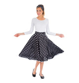 The image shows a black skirt with white polka dots and a matching headband, both designed as a two-piece set, likely intended for party or costume use.