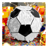 The image shows a piñata designed to resemble a soccer ball, intended for party use.