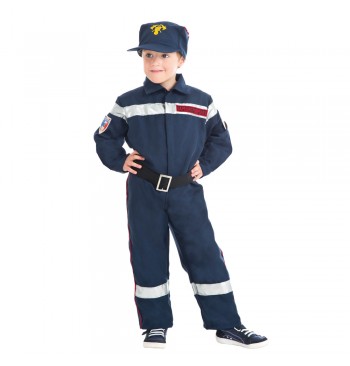 The image shows a child dressed in a firefighter costume, consisting of a red jacket and matching pants with reflective yellow stripes, and a red firefighter helmet. The background is plain, focusing attention on the costume.